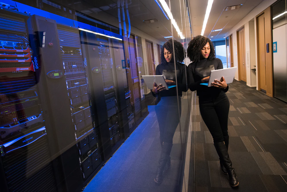 IT professional reviewing cloud infrastructure in a data center